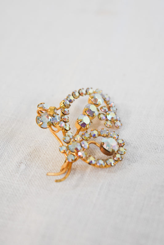 Glitzy golden brooch