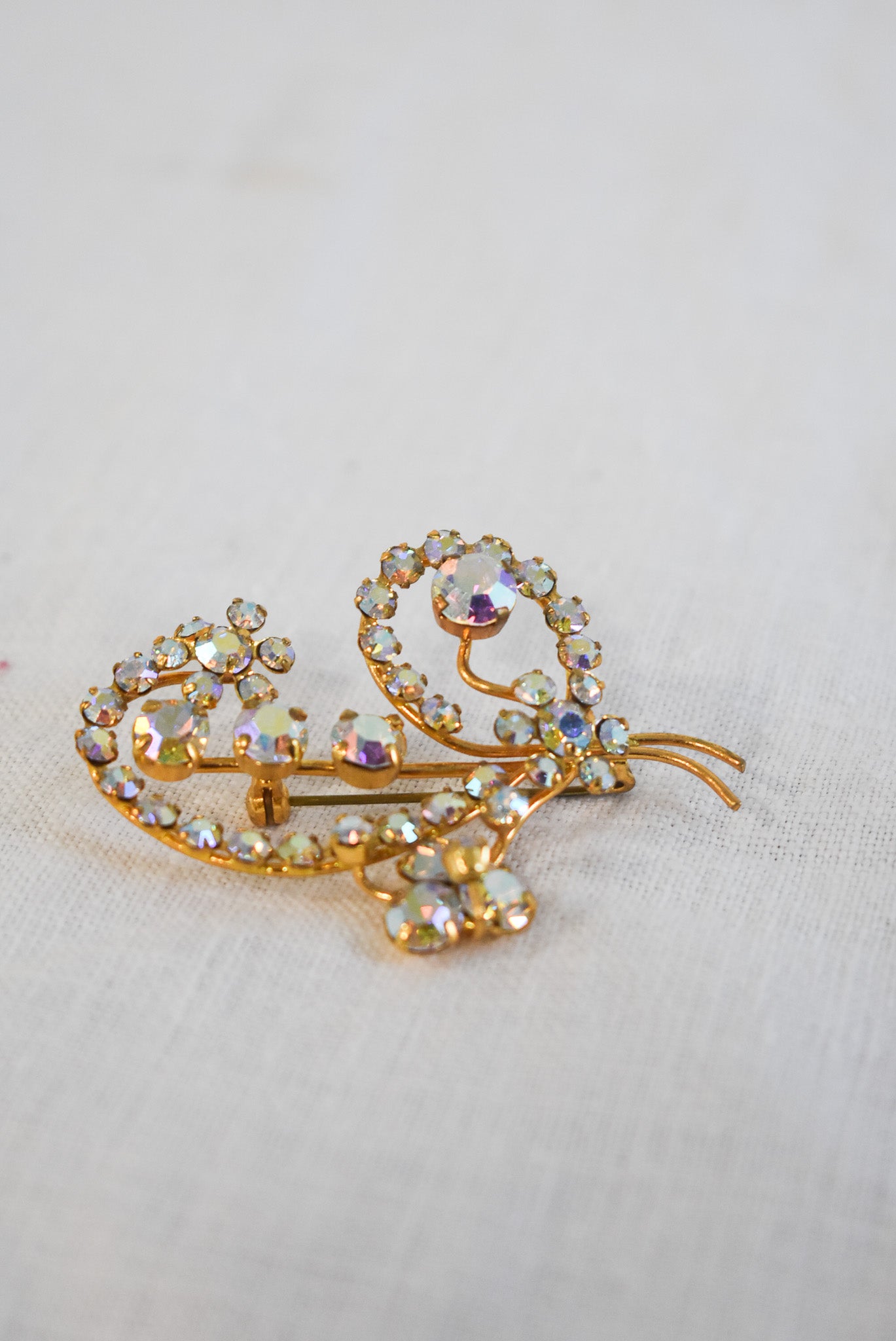 Glitzy golden brooch