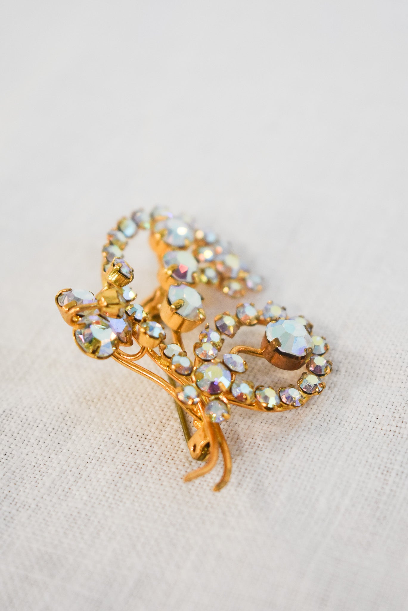 Glitzy golden brooch