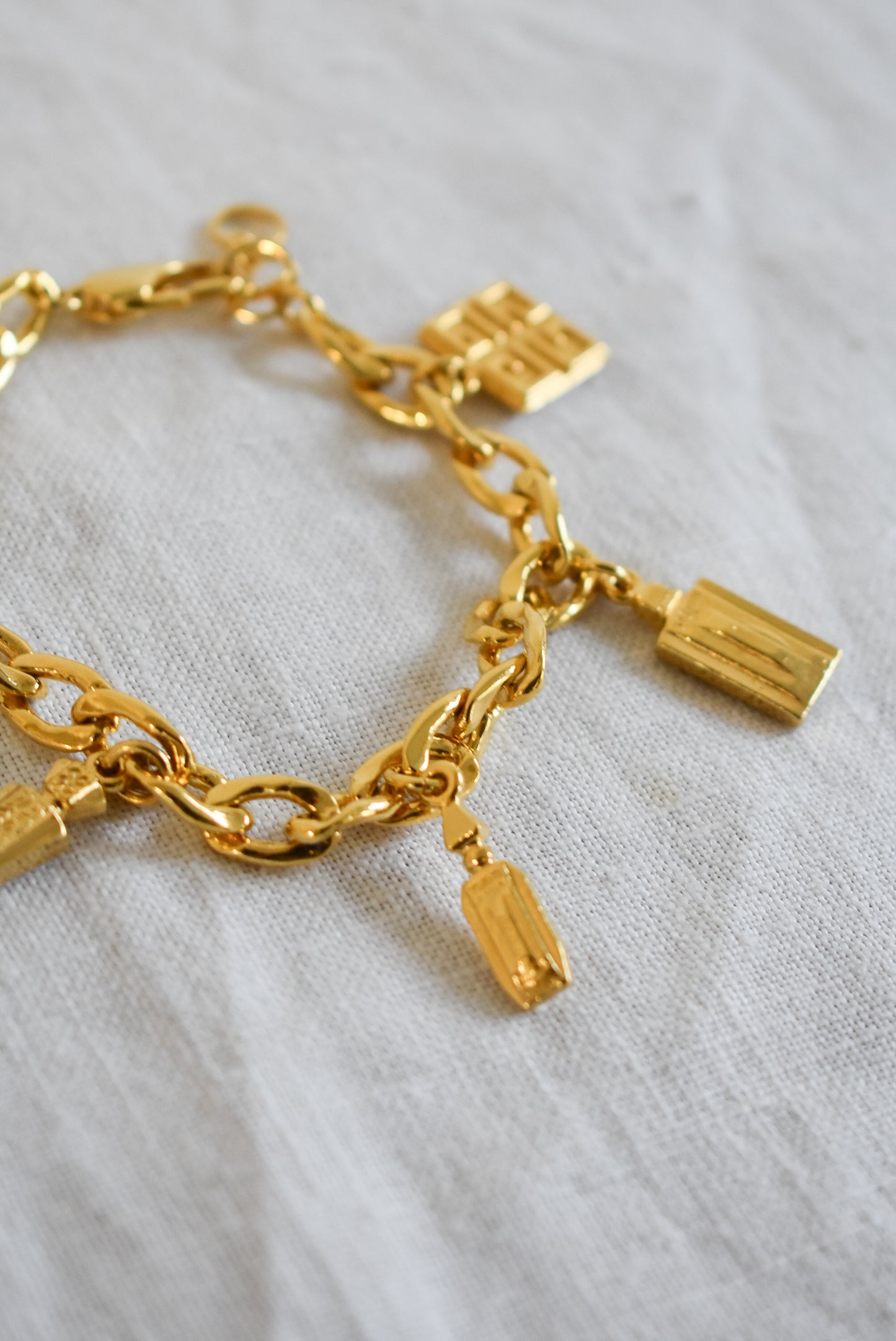 Vintage 1990's Givenchy perfume bottle charm bracelet