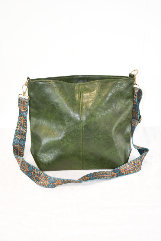 Forest green vegan leather shoulder bag with funky turquoise strap