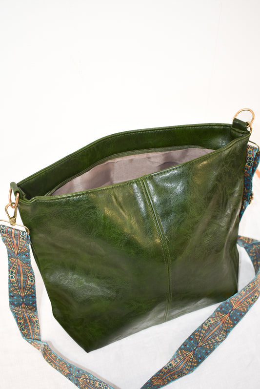 Forest green vegan leather shoulder bag with funky turquoise strap