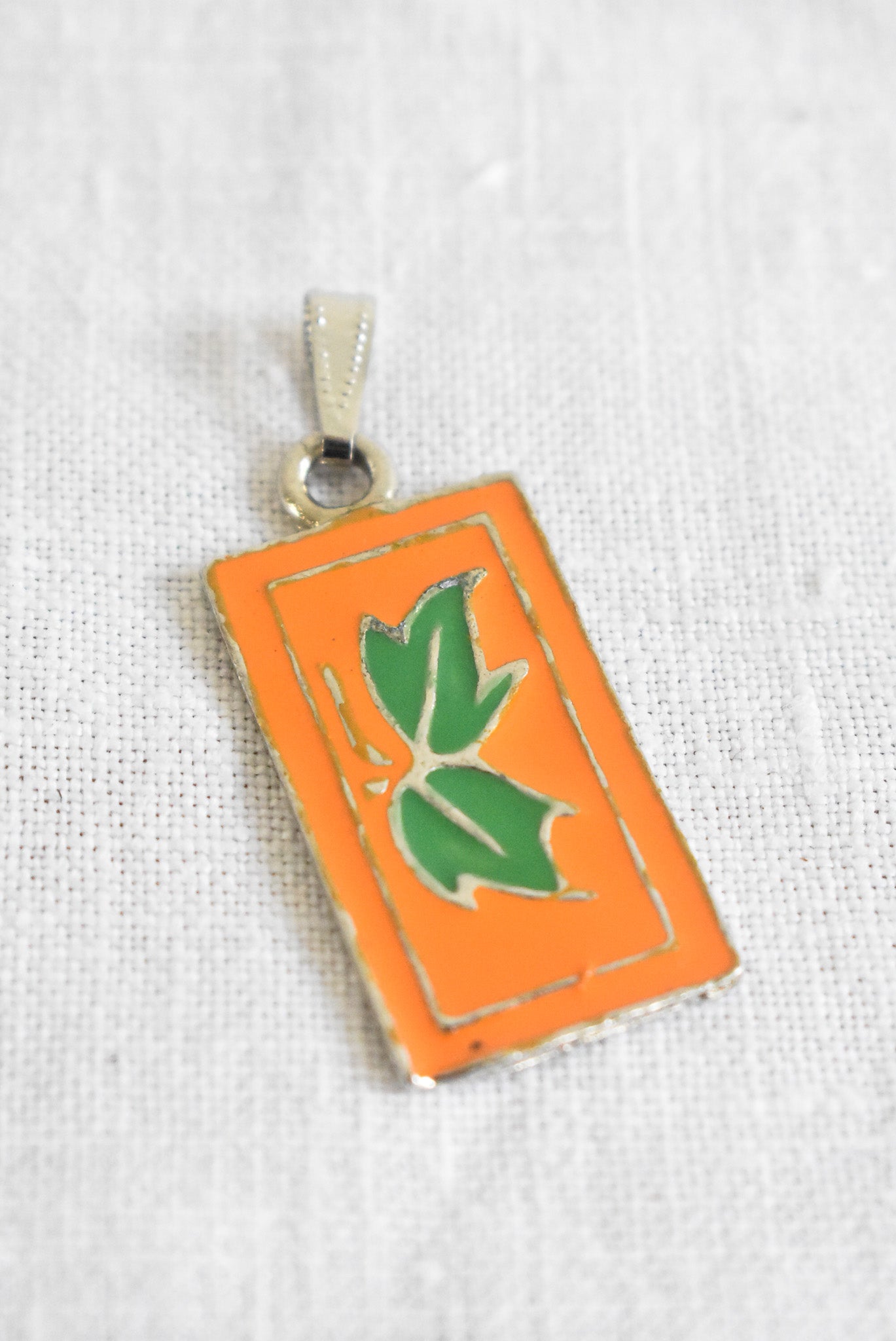 Orange rectangular leafy pendent