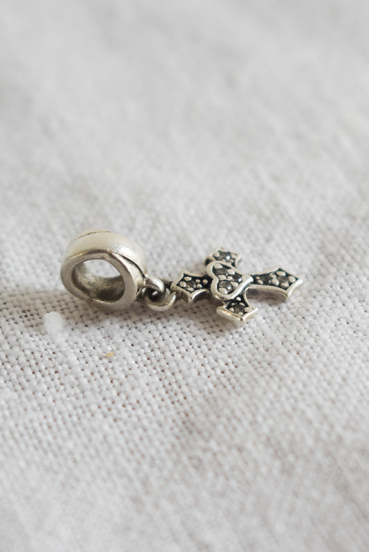 Sterling silver + diamond cross charm