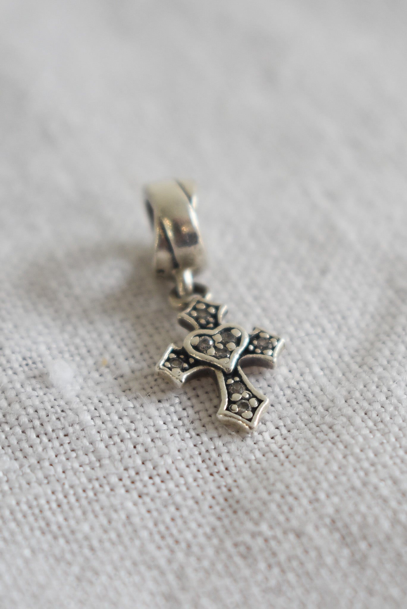 Sterling silver + diamond cross charm