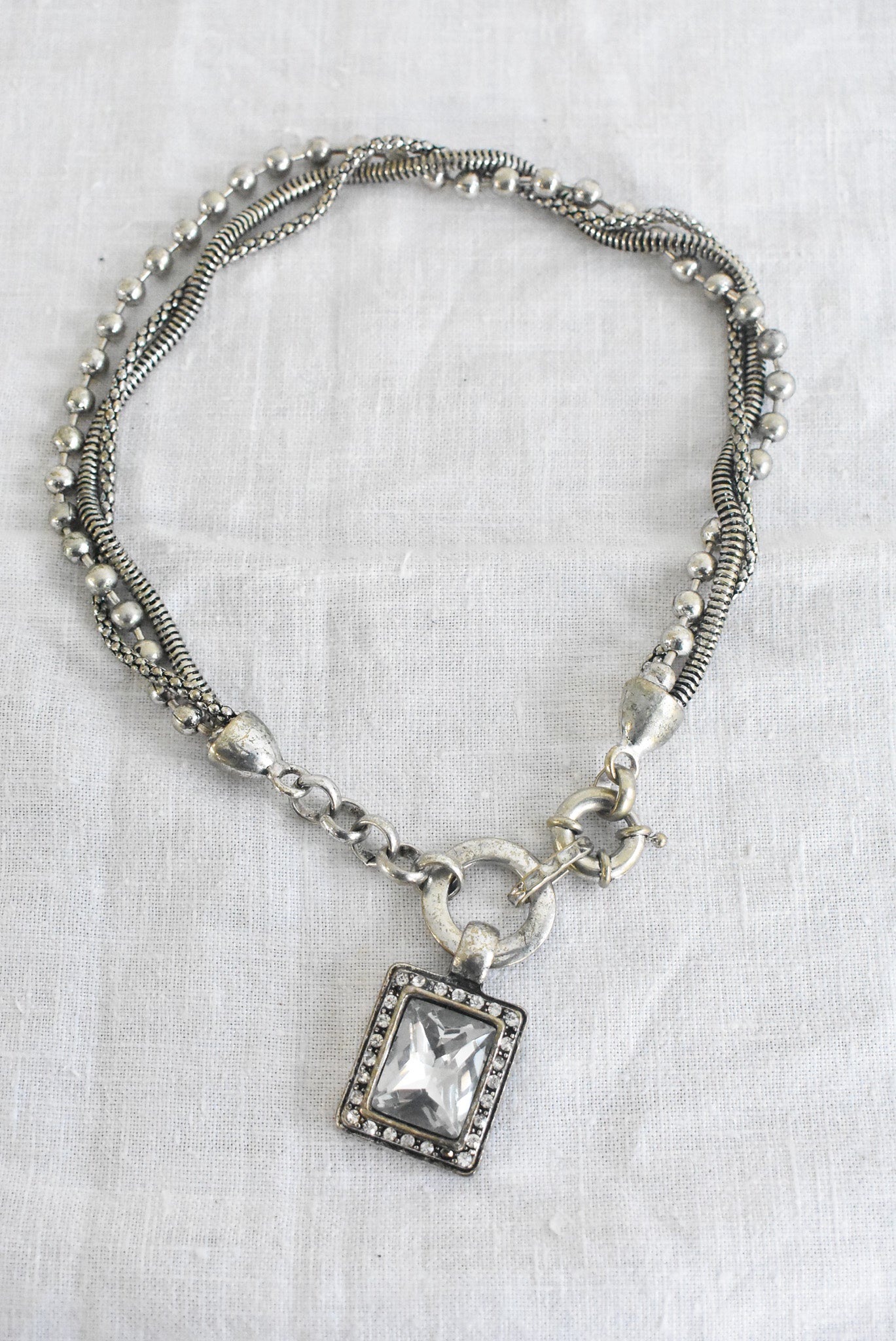 Chunky silver "heavy metal" necklace with square glass pendant