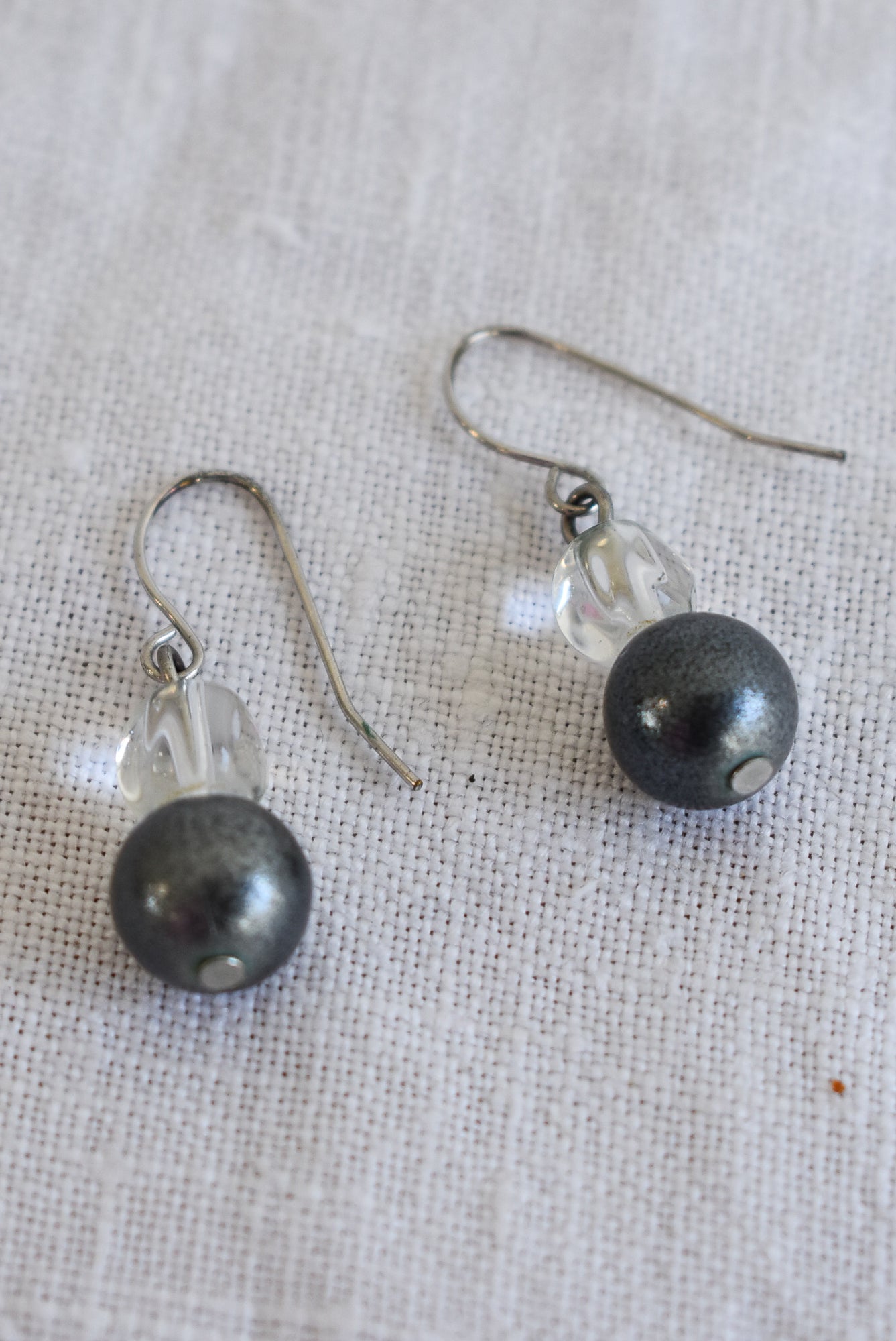 Simple silver coloured glass bead dangly earrings