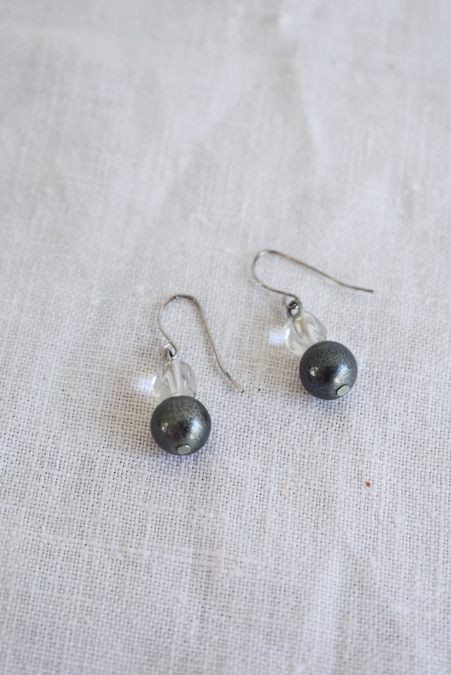 Simple silver coloured glass bead dangly earrings