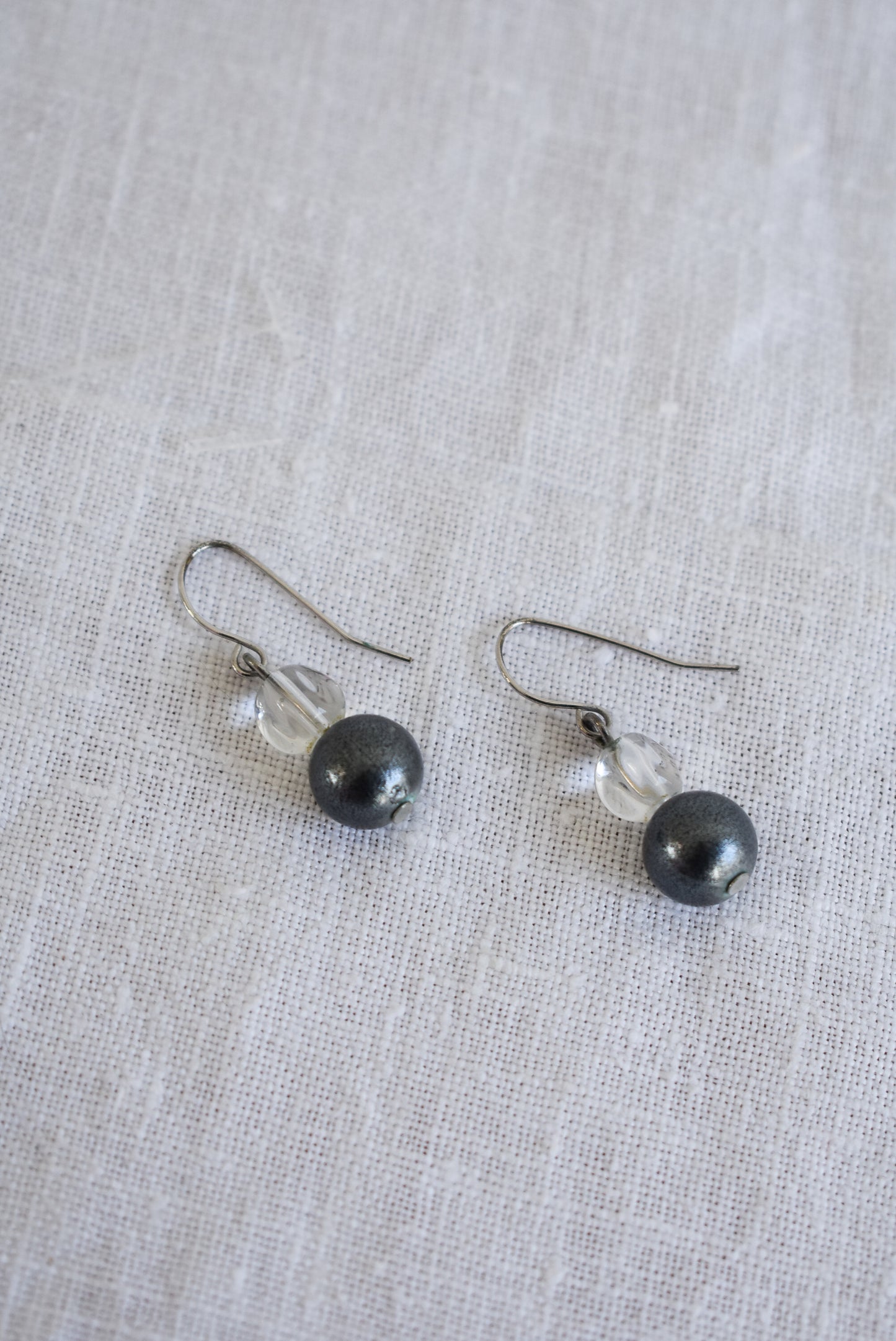 Simple silver coloured glass bead dangly earrings