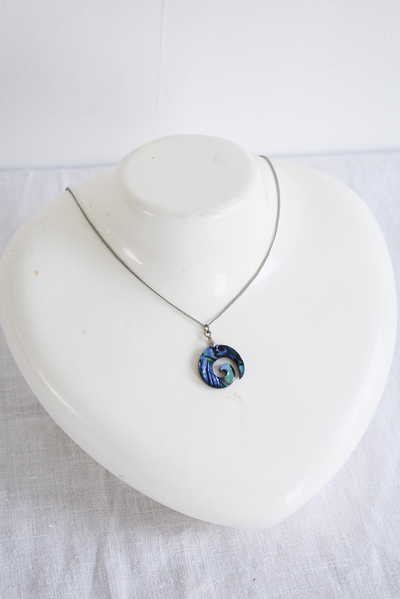 Wood + Paua Koru necklace