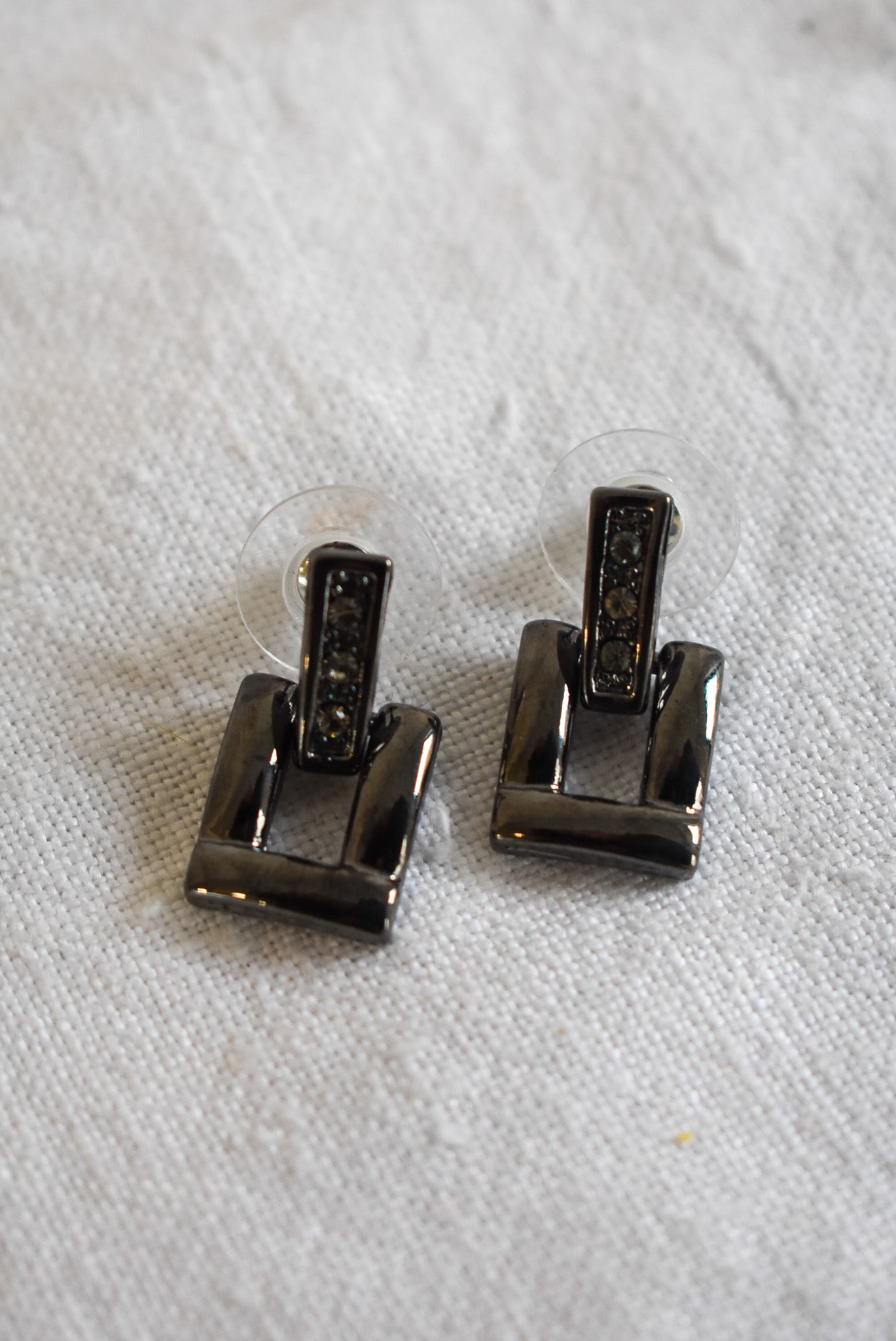Dangly buckle studs