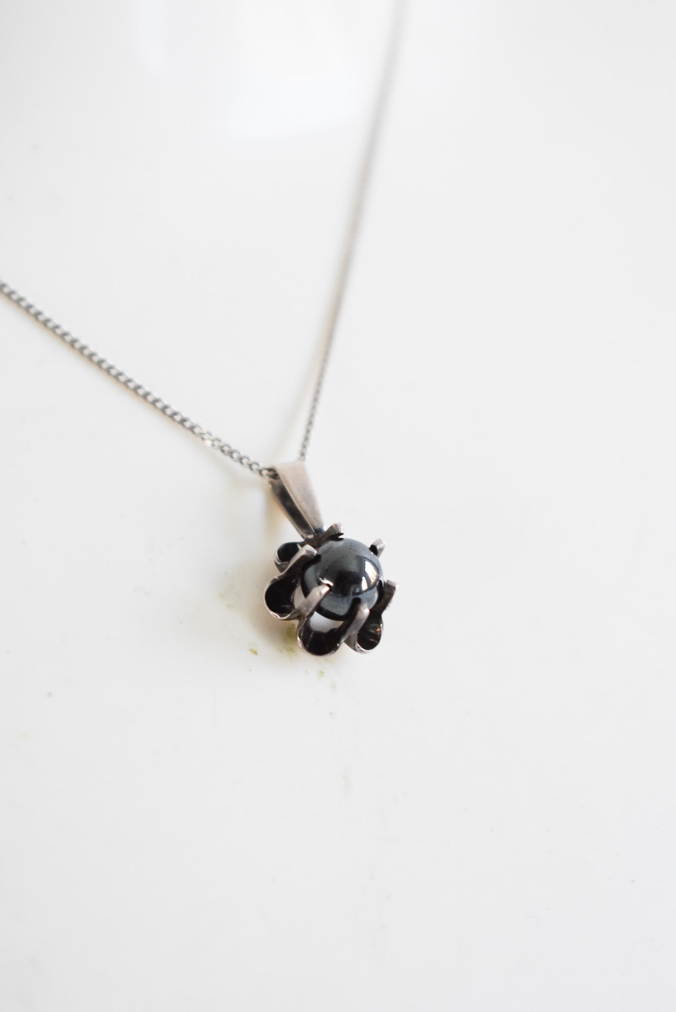 Silver necklace with flower pendant