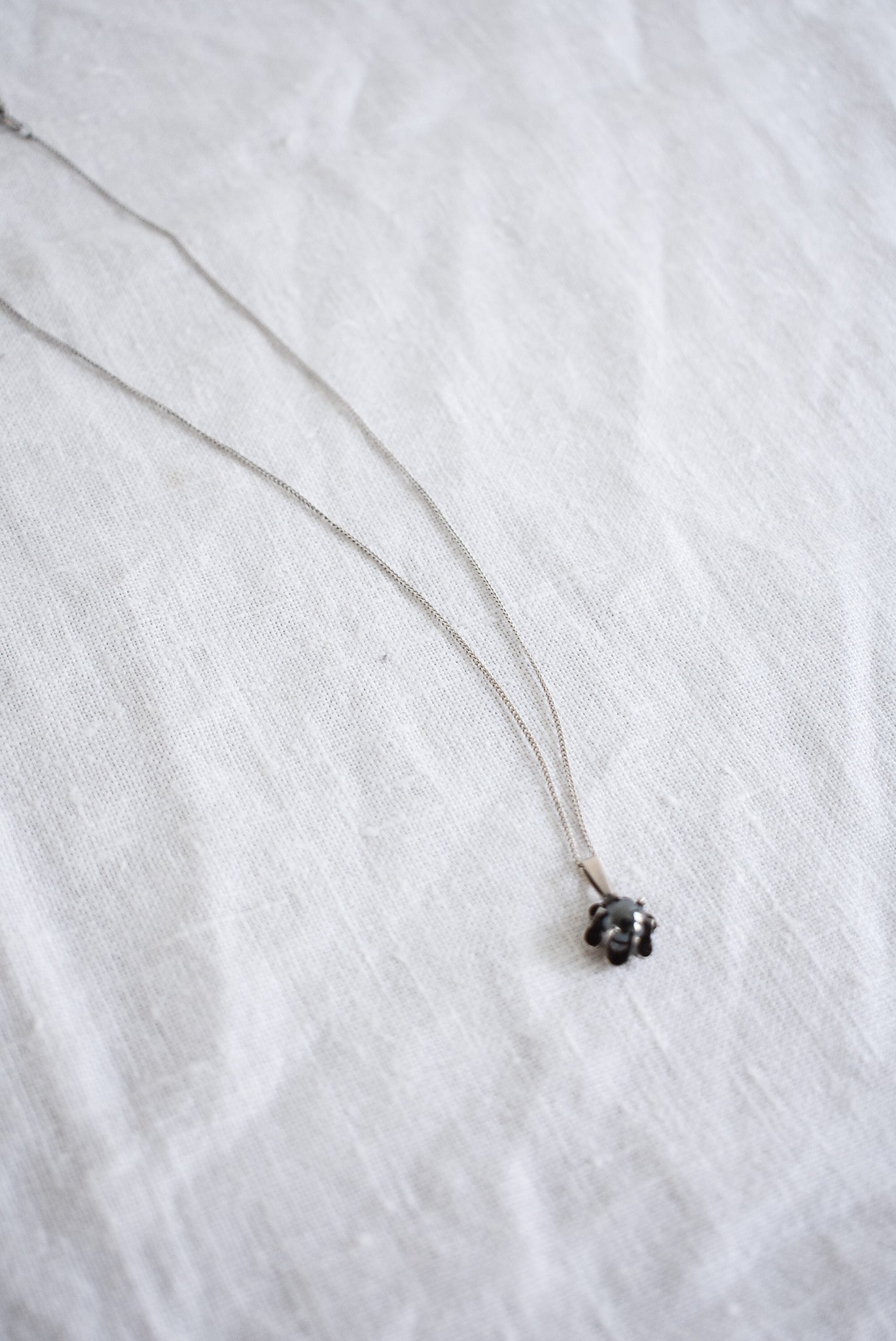 Silver necklace with flower pendant