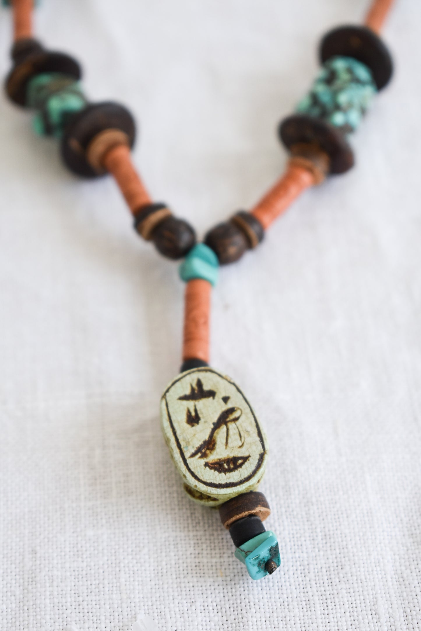 Wood and turquoise charm necklace