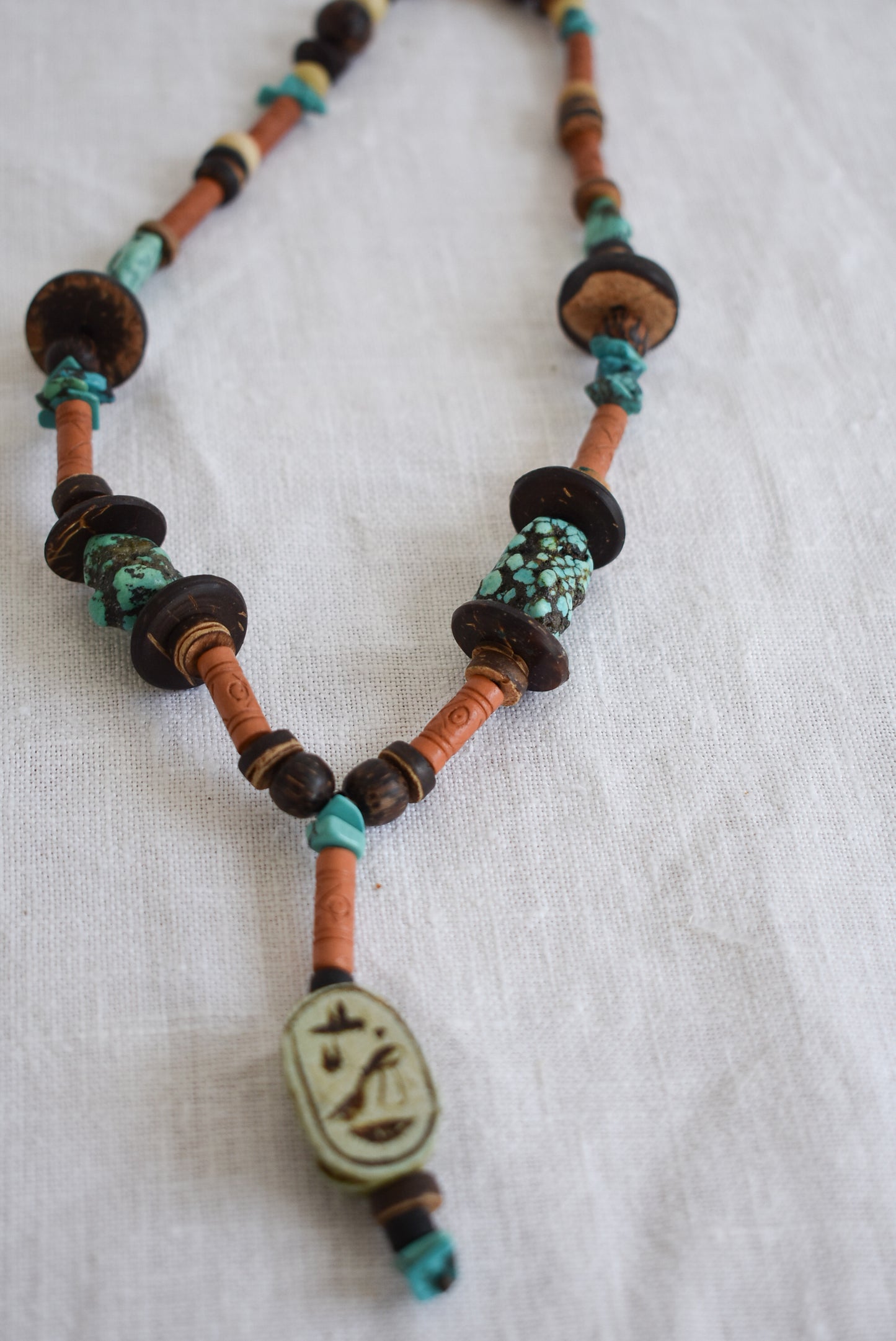 Wood and turquoise charm necklace