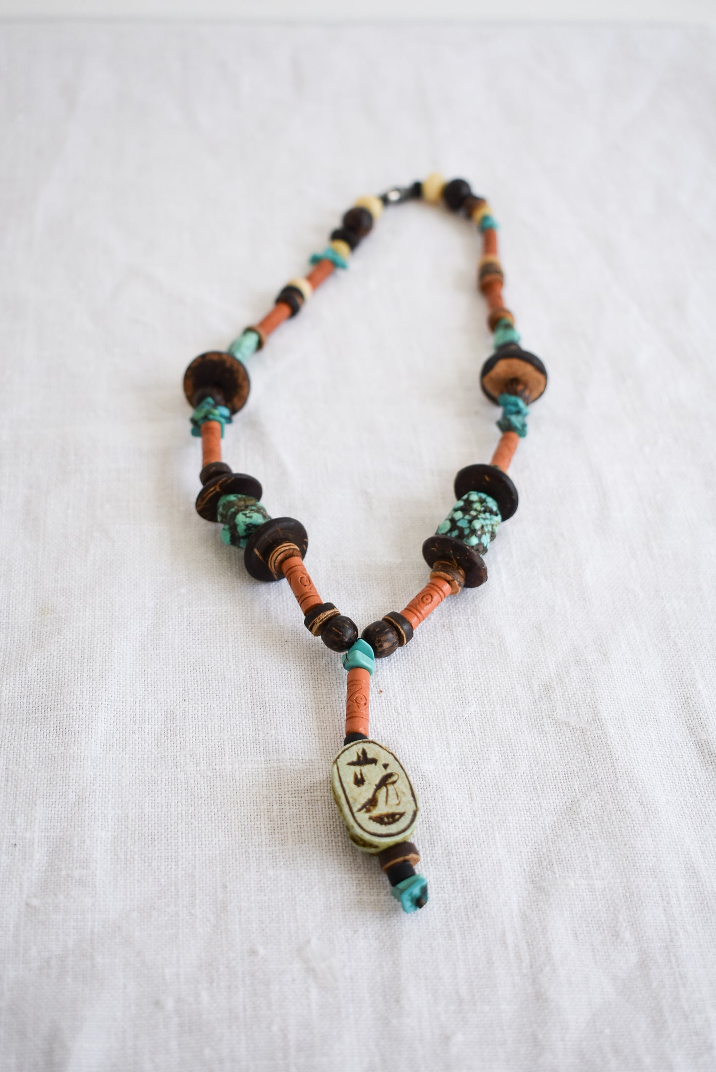 Wood and turquoise charm necklace