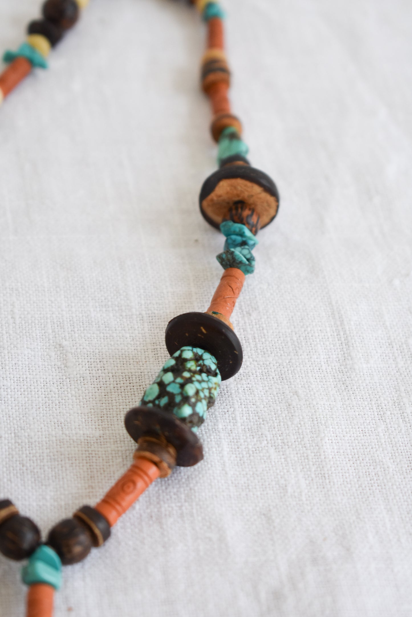 Wood and turquoise charm necklace