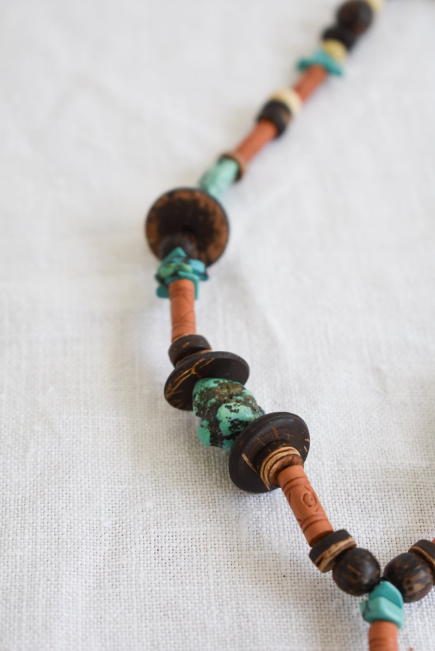 Wood and turquoise charm necklace