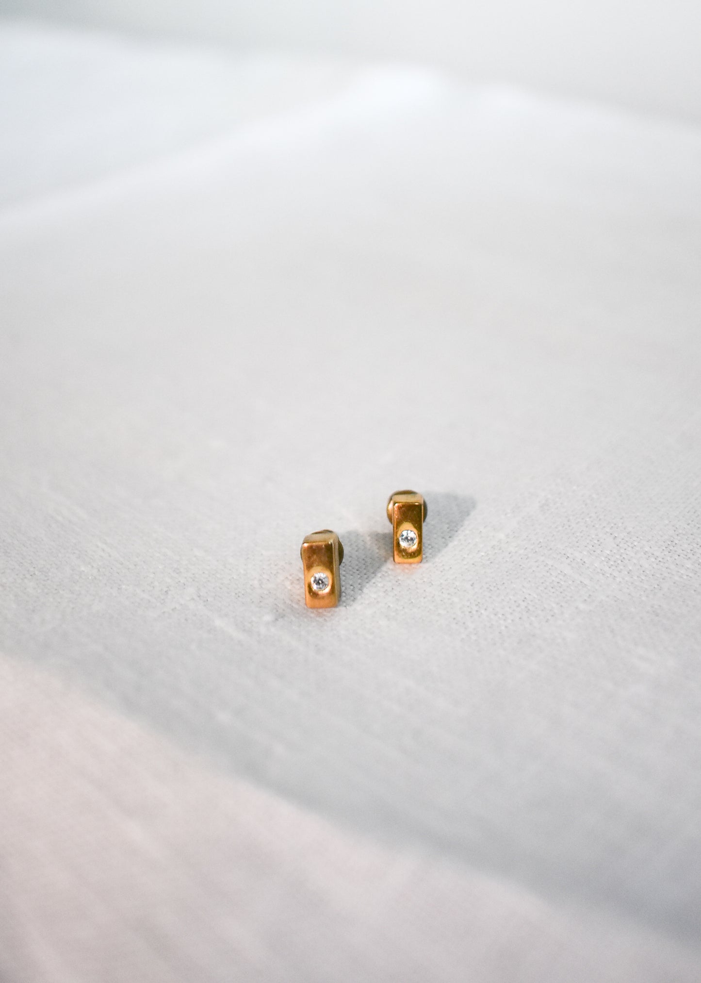 Gold coloured cuboid stud earrings