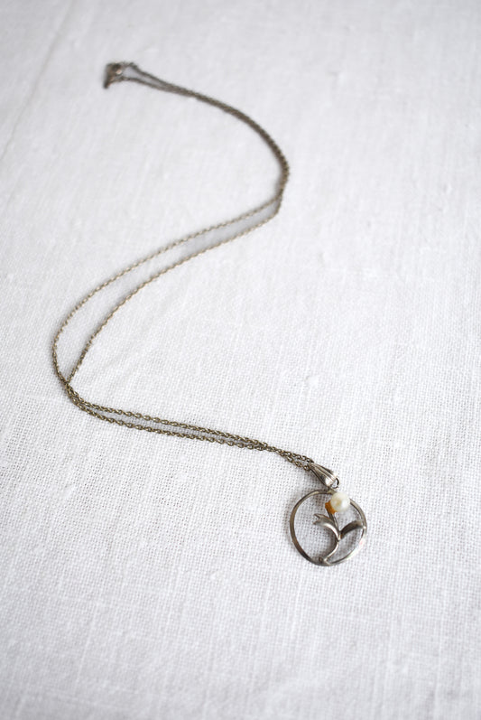 Silver and pearl circle pendant