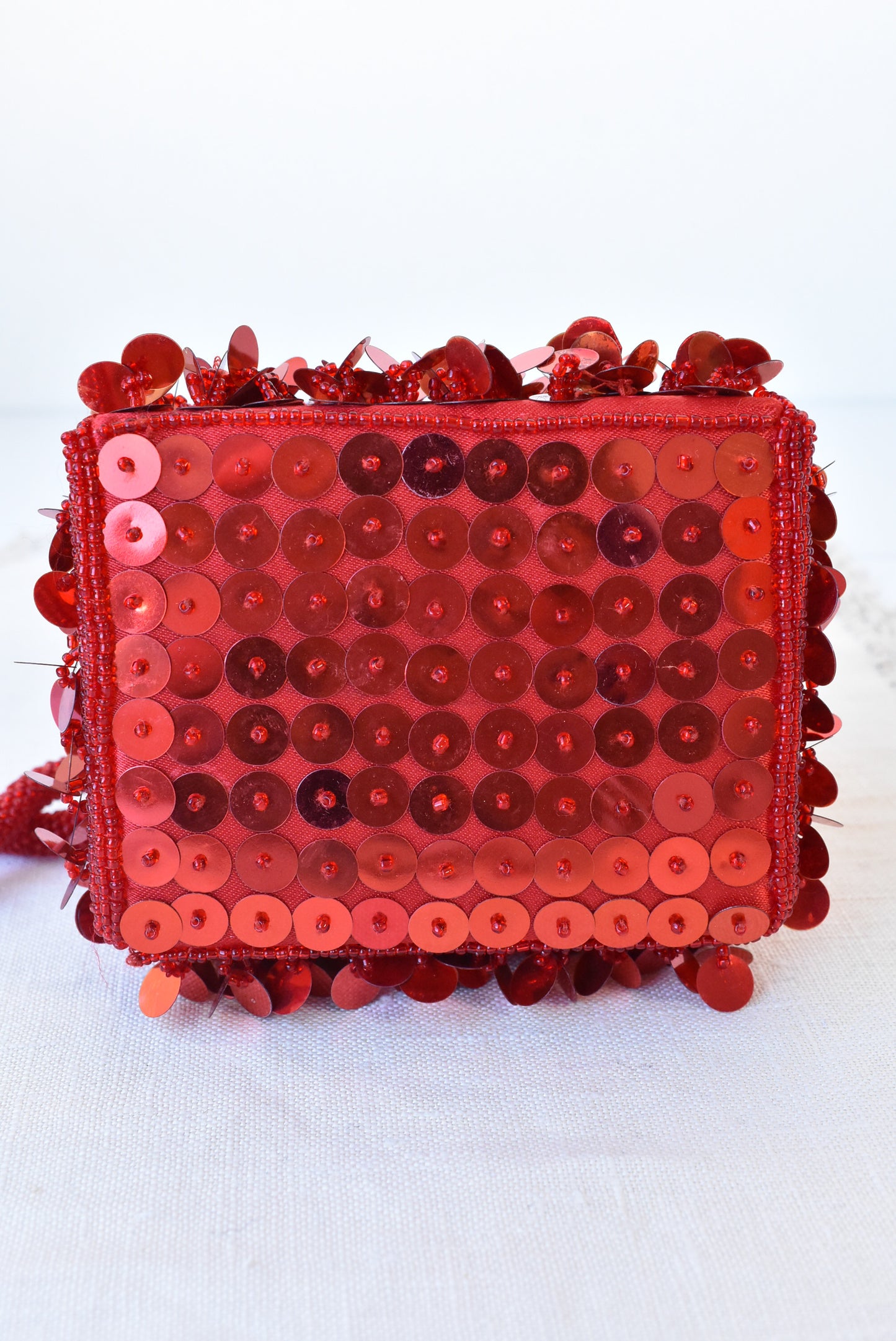 Sparkly red wristlet bag