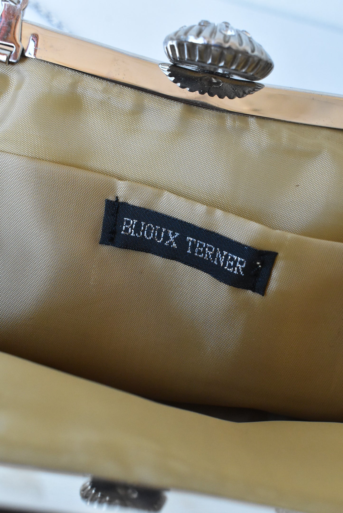 Bijoux Terner shell clasp golden fabric clutch bag