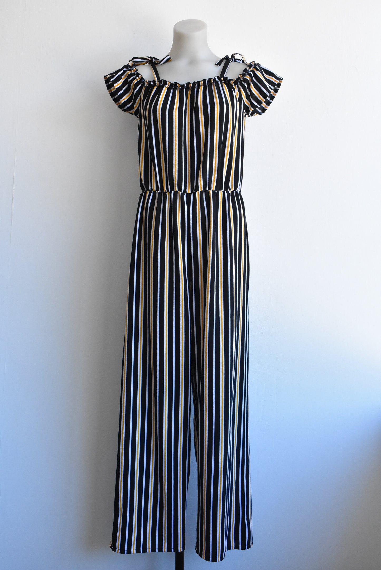 Switch Girls off-the-shoulder black/orange striped jumpsuit, size 16yrs (likely fit size 6/8 adult)