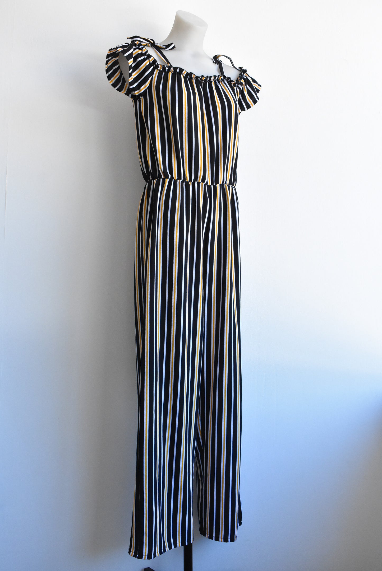 Switch Girls off-the-shoulder black/orange striped jumpsuit, size 16yrs (likely fit size 6/8 adult)