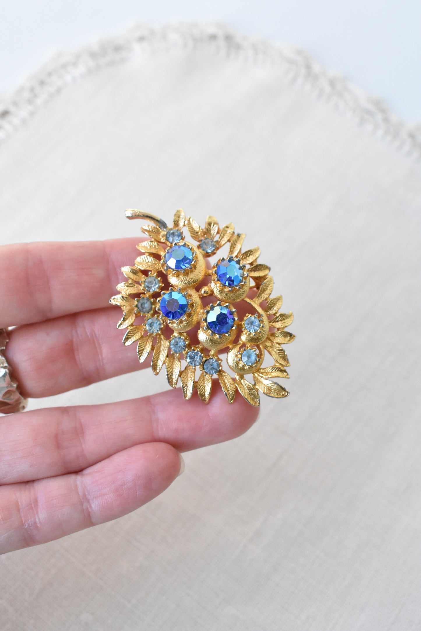 Vintage golden + blue gems brooch