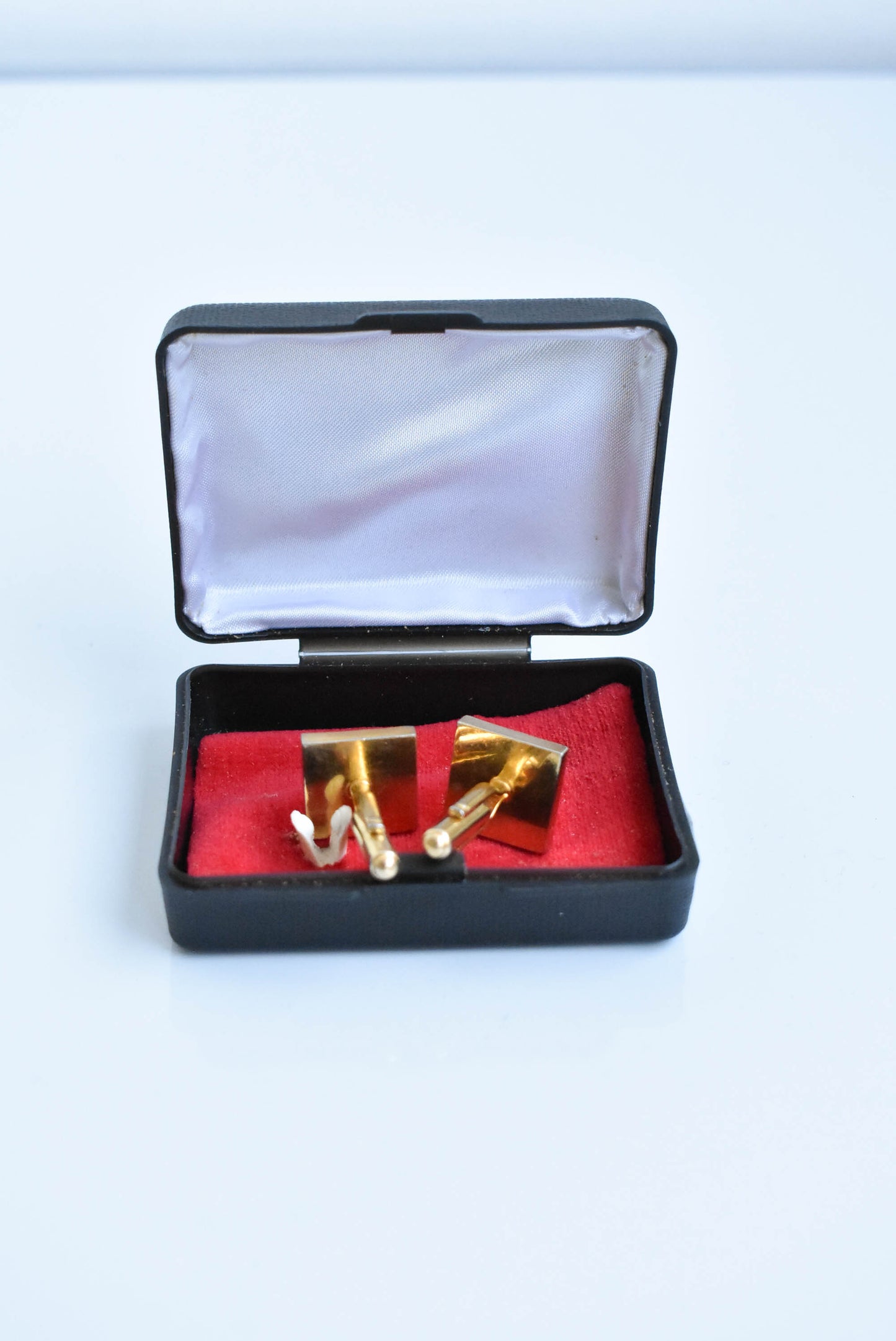 Retro cufflinks in box, golden with square emblem