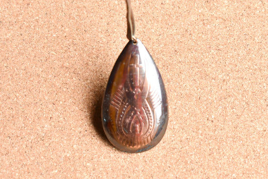 Copper teardrop necklace with leather strap.
