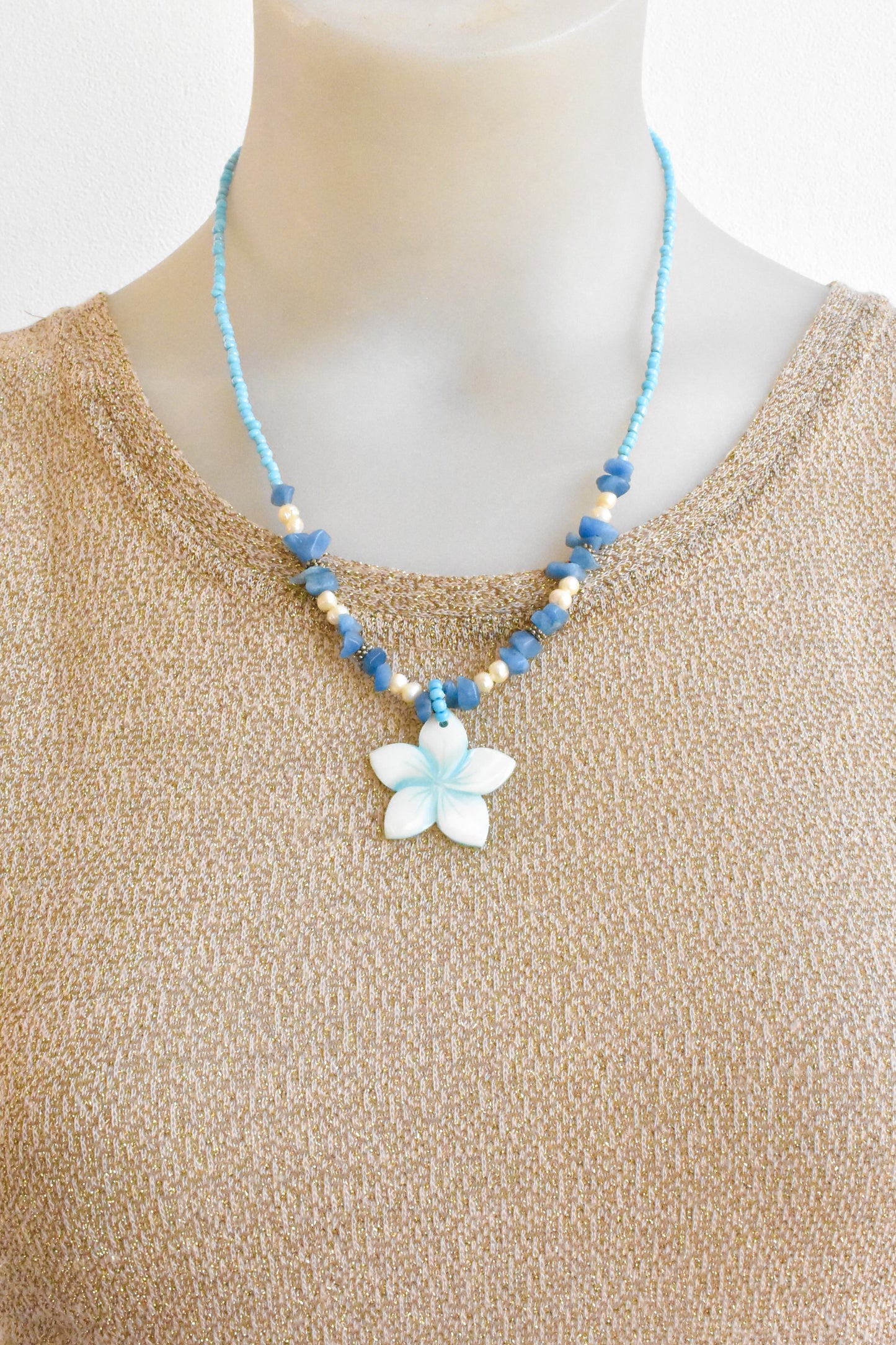 Flower pendant necklace with pearls, shell and blue gemstones