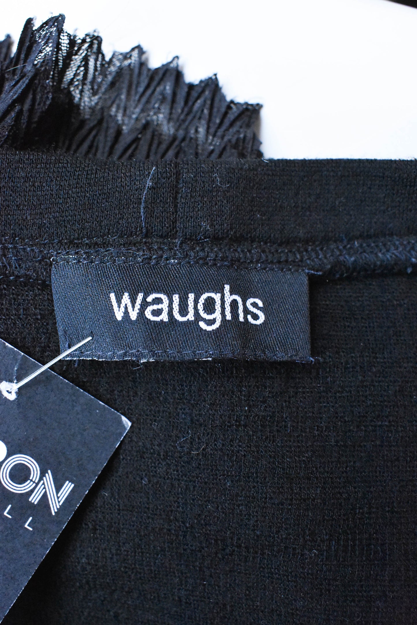 Waughs fringed black wool top