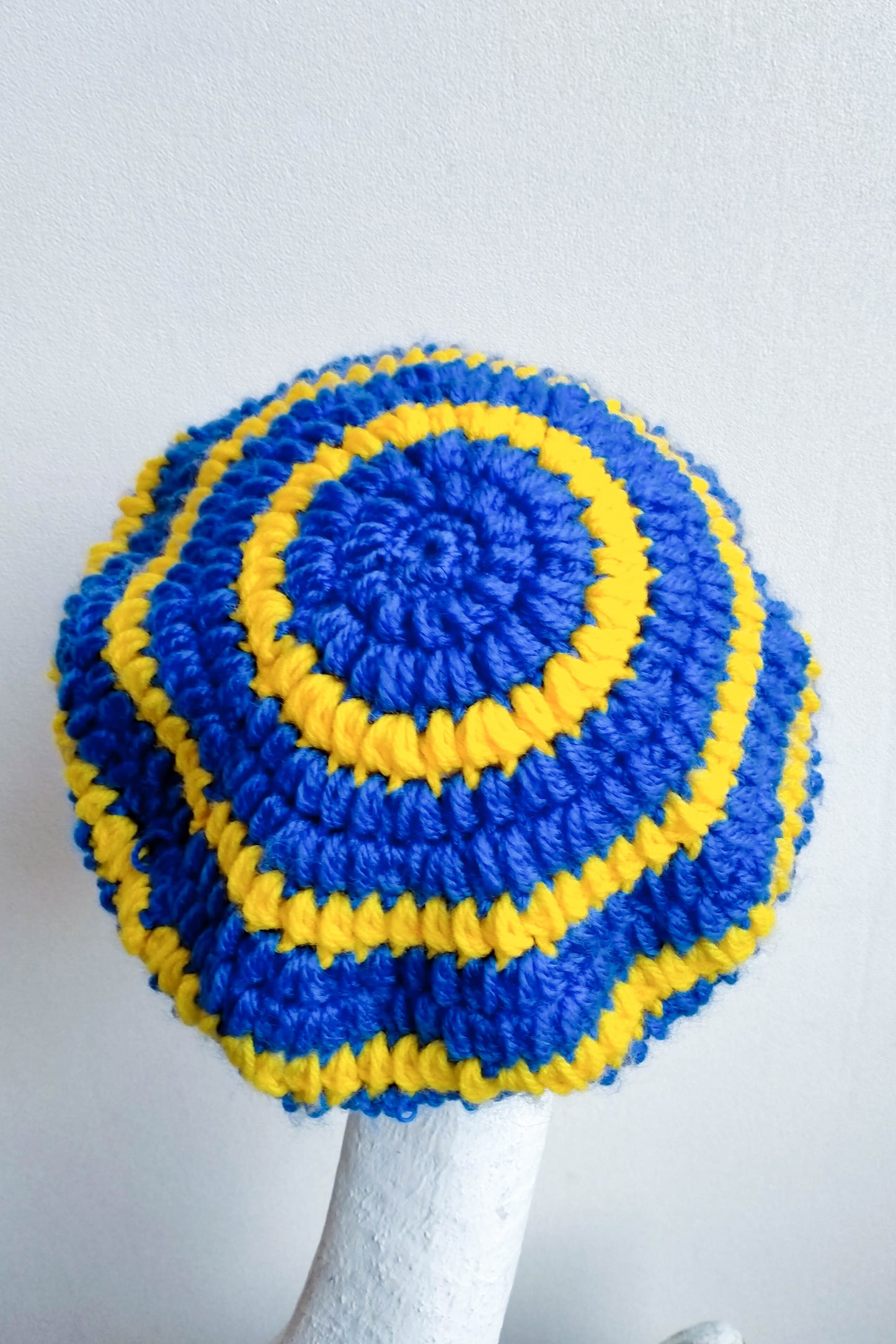 Blue and yellow crocheted newsboy cap
