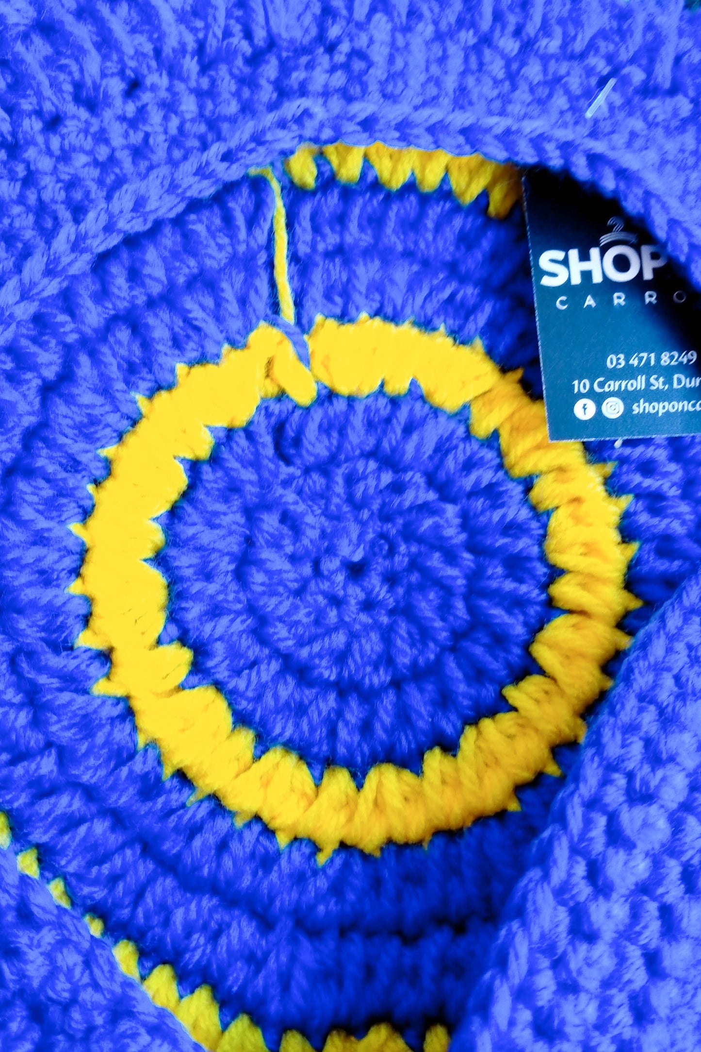 Blue and yellow crocheted newsboy cap