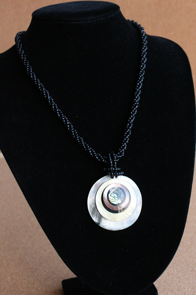 Shell and bead pendant