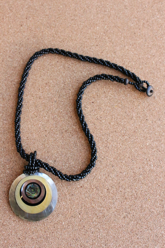 Shell and bead pendant