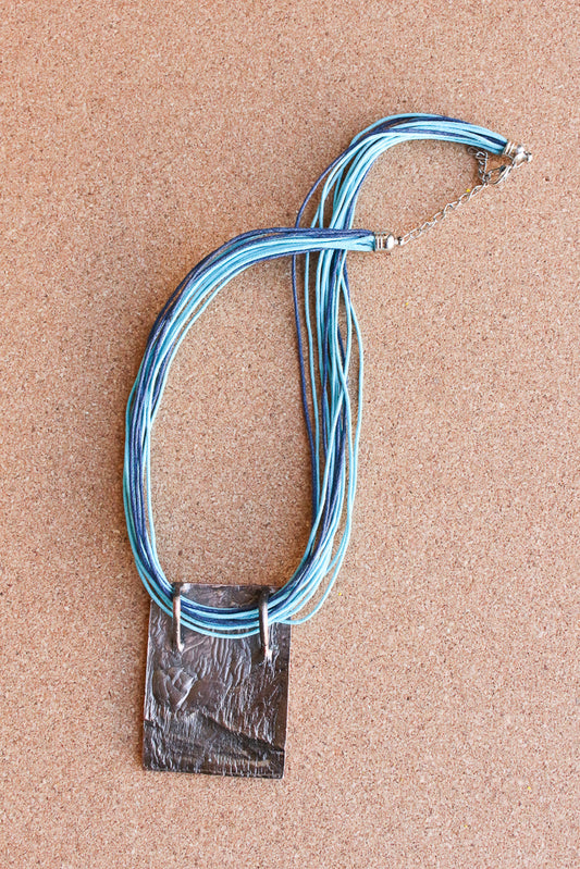 Blue enameled pendant