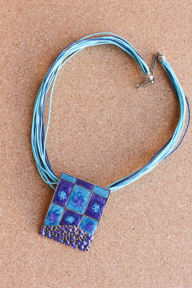 Blue enameled pendant