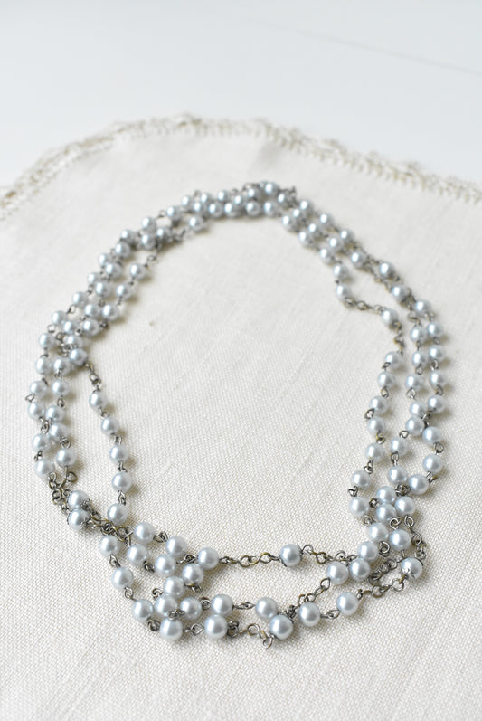 Long pearlescent bead necklace