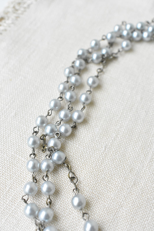 Long pearlescent bead necklace