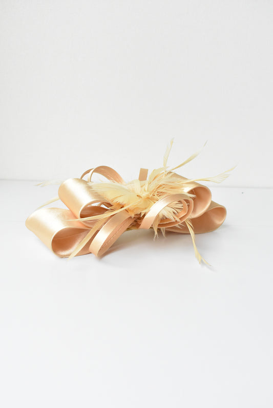 Apricot satin and feather fascinator