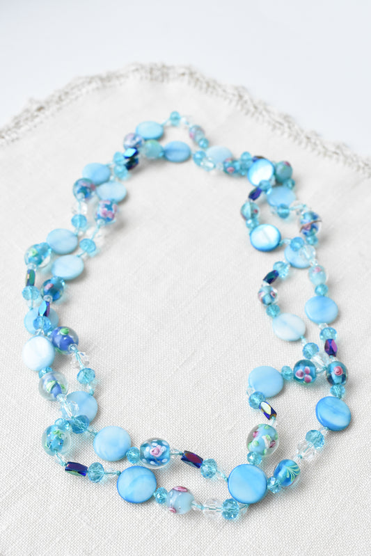 Vibrant long blue floral bead necklace